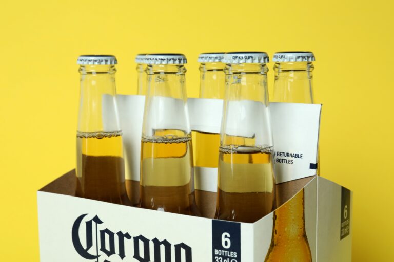 Carton Box with Corona Extra on Yellow Background - Corona Extra beer distributor